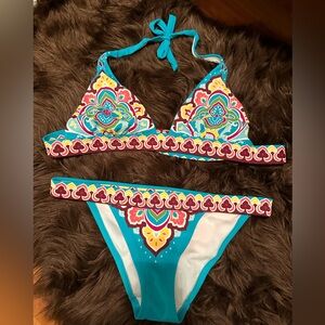 Victoria’s Secret multi color bikini. Top size S. Bottoms size XS.